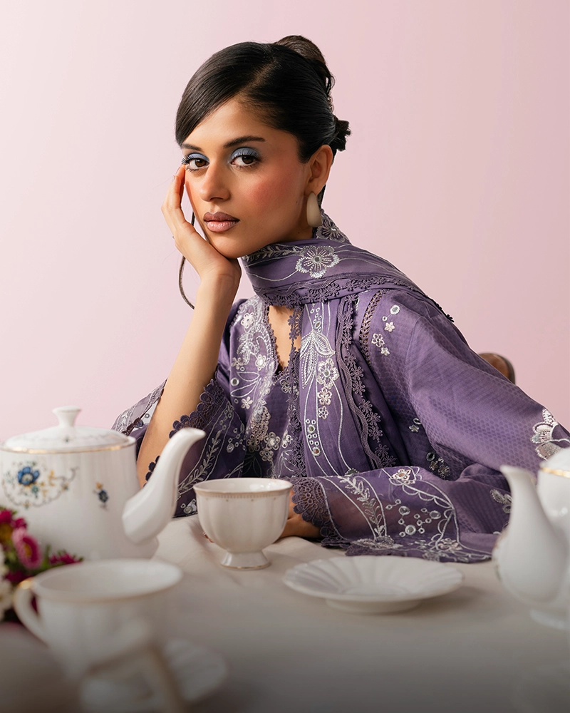 Al Shanaz ready-to-wear — embroidered lavender suit in a curated tea-time setting